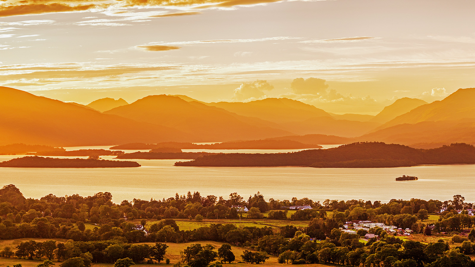 Aerial view across the islands and wooded shores of Loch Lomond